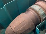 a large blue container with a large brown object inside of it