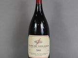 a bottle of wine that is sitting on a table
