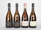 trois bouteilles de vin posées l'une à côté de l'autre sur une table