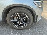 a close up of a car ' s tire on the road