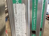 three different types of metal pipes in a warehouse