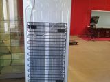 an image of a refrigerator in a room with a red wall