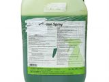 a close up of a container of green liquid on a white background