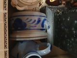 a lot of cups and teapots in a box