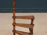 an image of a wooden shelf with three shelves on it