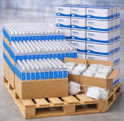 several boxes of water sitting on top of a wooden pallet