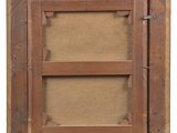 a close up of a picture of a wooden frame with a label on it