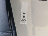 a close up of a label on a blue jacket