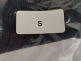 a picture of a plastic bag with a name tag on it