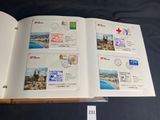 a book with stamps on it sitting on a table