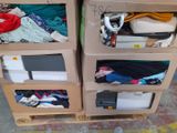 two boxes that have clothes and electronics inside of them