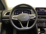 the interior of a car with a steering wheel and dashboard controls
