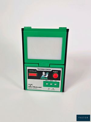 une Nintendo Game Boy verte posée sur une surface blanche