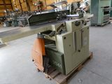 a machine that is sitting on a pallet in a warehouse