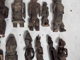 a lot of wooden figurines that are on a table