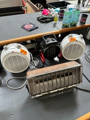 a table with a radio, speakers, and other electronics on it