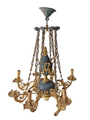 an image of a chandelier with a statue on the top of it