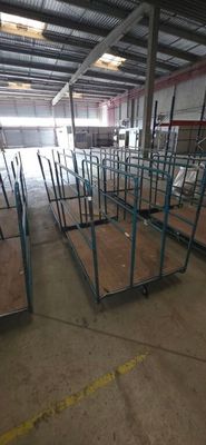 a large warehouse with a lot of tables in it
