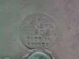 a green fire hydrant that has a sign on it