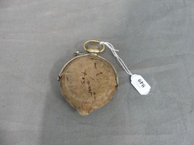 a small purse with a tag on it sitting on a table