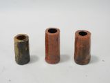 three different types of pipe holders on a white surface