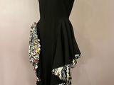 a black dress with sequins and sequins on a mannequin mannequin