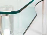 a glass table with a glass shelf on it