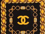 a black and gold scarf with a chanel logo on it