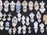 a picture of a collection of porcelain vases on a black background