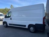 a picture of a white van parked in a parking lot