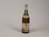 a bottle of wine that is sitting on a table