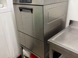 a stainless steel dishwasher sitting next to a sink in a kitchen