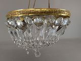 an image of a crystal chandelier hanging from a ceiling