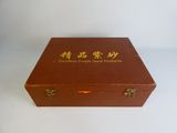 an old wooden box with chinese writing on it on a white surface