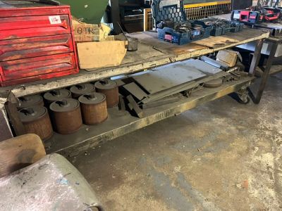 a workbench with tools on it in a garage