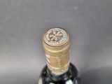 a bottle of wine that is sitting on a table