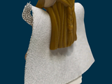 a figurine of a man with a long beard and a white robe