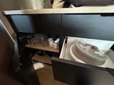 a small kitchen with a microwave and a dishwasher in it