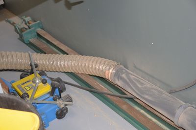 a hose attached to the side of a tank