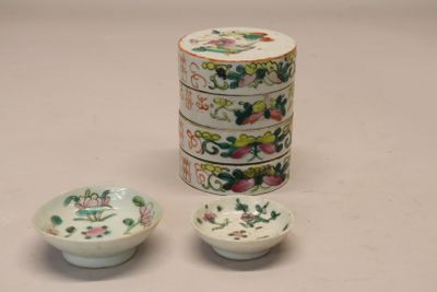 three small bowls and a small bowl sitting next to each other