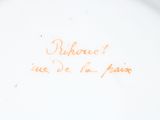 a white plate with a writing on it