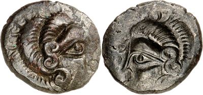 a silver coin with an image of a dragon on it