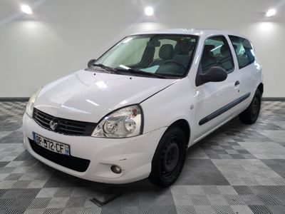 a picture of a small white car parked in a garage