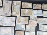 several different types of paper money laid out on a table