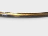 a small knife that is laying on a white surface