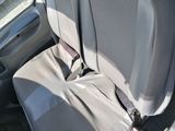 a seat in the back of a car with a seat belt