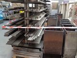 a large pile of steel beams in a warehouse