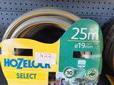 several different types of garden hoses on the shelf