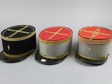 three hats are lined up on top of each other on a table