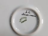 a close up of a white plate with writing on it